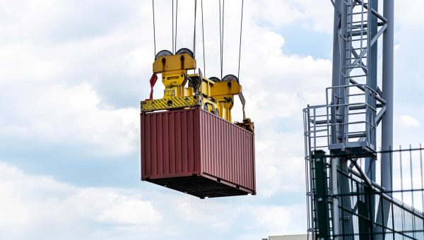 a-container-gantry-crane-on-a-rail-loads-the-container-into-a-barge.jpg